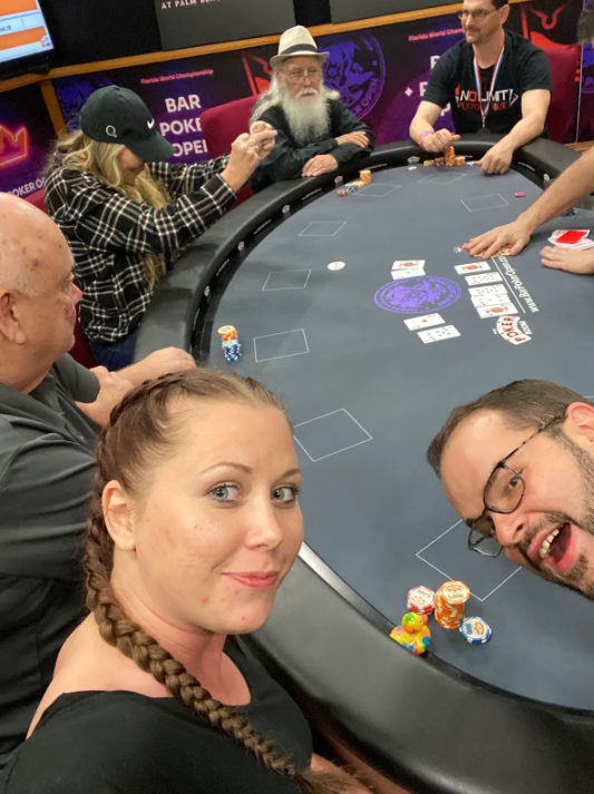 At the poker table — players at the poker table.